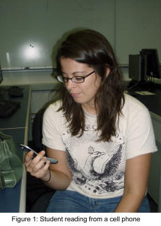 Figure 1: student reading from a cell phone.