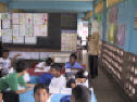 Elementary classroom with teacher - click to enlarge